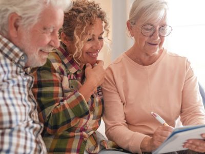 smiling-senior-couple-and-caregiver-sharing-a-mome-2025-07-16-21-02-26-utc-2